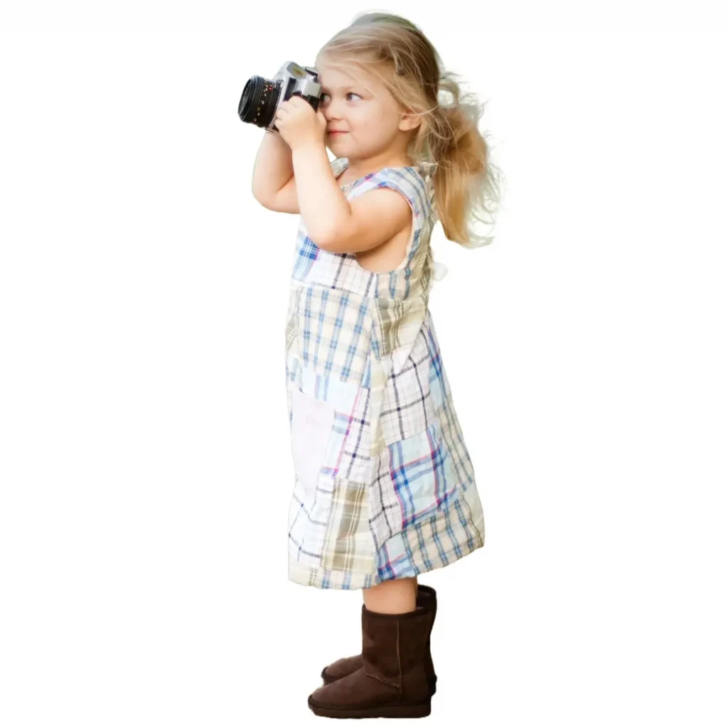 picture of a small child holding a camera as a photographer